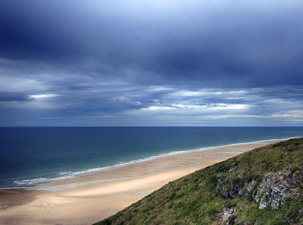 Dark Sky Over A Blue Sea